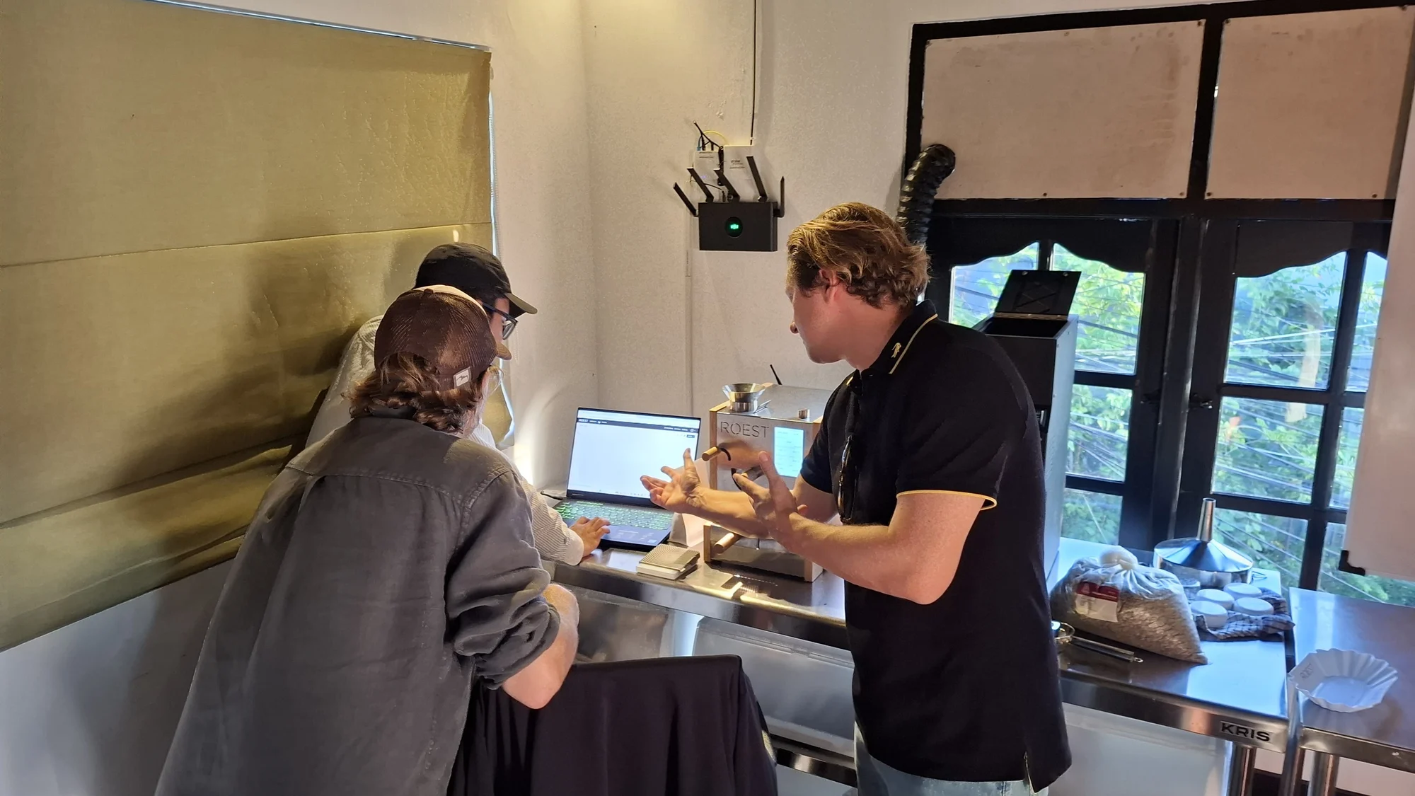 Workshop participants gathered around the ROEST coffee roaster