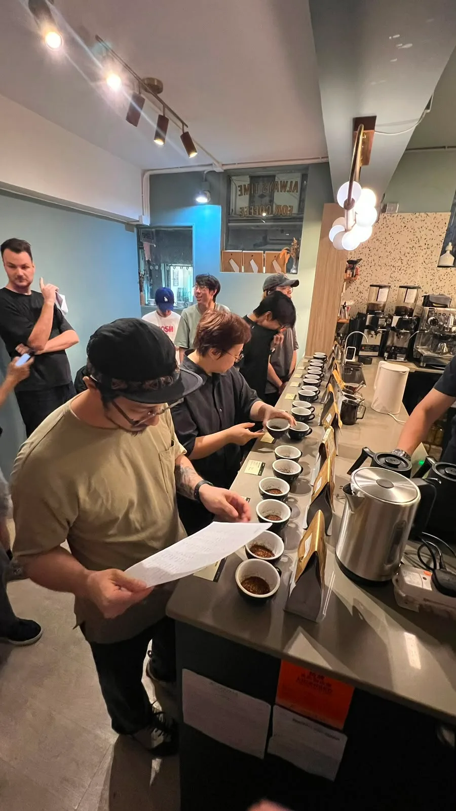 Participants tasting coffees together at First Crack Coffee in Hong Kong